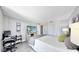 This spacious bedroom offers a workspace and bright, calming decor at 14820 Rue De Bayonne # 308, Clearwater, FL 33762