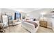 Bright, neutral bedroom featuring a seating area and calming decor at 14820 Rue De Bayonne # 308, Clearwater, FL 33762