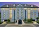 The well lit exterior of the building, highlighting the entrance at 14820 Rue De Bayonne # 308, Clearwater, FL 33762