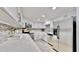 Updated kitchen features stainless steel appliances, light gray backsplash, and granite countertops at 14820 Rue De Bayonne # 308, Clearwater, FL 33762