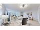 Open-concept living room with wood floors, modern furniture, and bright, neutral paint at 14820 Rue De Bayonne # 308, Clearwater, FL 33762