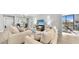 Bright living room featuring wood floors, modern décor and a view of the balcony at 14820 Rue De Bayonne # 308, Clearwater, FL 33762
