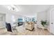 Bright living room with modern furniture, wood floors, and decorative lighting at 14820 Rue De Bayonne # 308, Clearwater, FL 33762