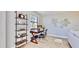 Cozy home office with built-in shelving, desk, and a view of the neighborhood at 14820 Rue De Bayonne # 308, Clearwater, FL 33762