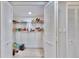 Pantry has ample shelving for storage and organization at 14820 Rue De Bayonne # 308, Clearwater, FL 33762