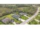 Aerial view of a beautiful house with a private pool and backyard pond at 16307 29Th E Ct, Parrish, FL 34219