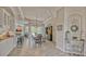 Dining area with a large dark wood table, views of the pool, and bar seating at 16307 29Th E Ct, Parrish, FL 34219