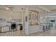 Home bar area with a view into office space and a living room at 16307 29Th E Ct, Parrish, FL 34219