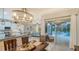 Dining area with a view of the pool, kitchen, and living room at 16307 29Th E Ct, Parrish, FL 34219