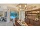 Formal dining room with sliding glass doors leading to the pool and outdoor living at 16307 29Th E Ct, Parrish, FL 34219