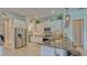 Modern kitchen features stainless steel appliances, granite countertops, and tiled backsplash at 16307 29Th E Ct, Parrish, FL 34219