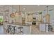 Bright open kitchen features granite countertops, stainless appliances, and a breakfast bar with seating at 16307 29Th E Ct, Parrish, FL 34219