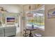 The living room view features pool access and a cozy dining area with an attractive chandelier at 16307 29Th E Ct, Parrish, FL 34219