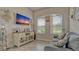 Cozy living room showcases stylish decor, wood-look floors, and plenty of natural light at 16307 29Th E Ct, Parrish, FL 34219