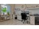 Bright home office with lots of storage, shelving, and neutral paint at 16307 29Th E Ct, Parrish, FL 34219