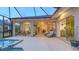 Large patio with a pool and lots of seating areas at 16307 29Th E Ct, Parrish, FL 34219