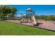 A well-maintained playground featuring slides and climbing equipment at 16307 29Th E Ct, Parrish, FL 34219