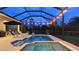 Outdoor living space with screened-in pool, spa and comfortable seating at 16307 29Th E Ct, Parrish, FL 34219