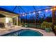 Outdoor patio featuring a screened in-ground pool with attached spa at 16307 29Th E Ct, Parrish, FL 34219