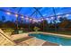 Relaxing screened pool with patio furniture and overhead string lights at 16307 29Th E Ct, Parrish, FL 34219