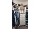 Organized walk-in closet featuring built-in shelving and drawers for optimal storage solutions at 16307 29Th E Ct, Parrish, FL 34219