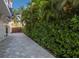 Private backyard with paver patio and lush landscaping at 201 N Harbor Dr, Holmes Beach, FL 34217