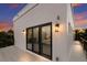 Modern balcony with glass doors and sunset view at 201 N Harbor Dr, Holmes Beach, FL 34217