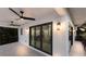 Covered balcony with ceiling fans and glass doors at 201 N Harbor Dr, Holmes Beach, FL 34217