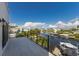 Spacious balcony overlooking the peaceful canal and neighboring houses at 201 N Harbor Dr, Holmes Beach, FL 34217