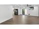 Finished basement with dark wood floors and ceiling fan at 201 N Harbor Dr, Holmes Beach, FL 34217