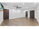 Finished basement with dark wood floors and two doors at 201 N Harbor Dr, Holmes Beach, FL 34217