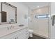 Modern bathroom with white vanity, quartz countertop, and a walk-in shower at 201 N Harbor Dr, Holmes Beach, FL 34217