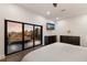 Main bedroom with large window and mounted TV at 201 N Harbor Dr, Holmes Beach, FL 34217