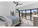 Bedroom with balcony access and city views at 201 N Harbor Dr, Holmes Beach, FL 34217