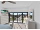 Bedroom with balcony access and city views at 201 N Harbor Dr, Holmes Beach, FL 34217