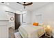 Bright bedroom with a sliding barn door and en-suite bathroom at 201 N Harbor Dr, Holmes Beach, FL 34217