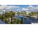 Scenic canal view from private balcony, showcasing waterfront homes and boats at 201 N Harbor Dr, Holmes Beach, FL 34217