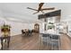 Bright dining area with wood table and chairs, adjacent to kitchen at 201 N Harbor Dr, Holmes Beach, FL 34217