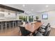 Modern dining area with live edge table and seating for eight at 201 N Harbor Dr, Holmes Beach, FL 34217