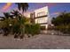 Modern home with a gated entry and well-manicured landscaping at 201 N Harbor Dr, Holmes Beach, FL 34217