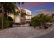 Modern home with a gated entry and beautifully landscaped front yard at 201 N Harbor Dr, Holmes Beach, FL 34217