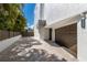 Attached garage with paved driveway and gated entrance at 201 N Harbor Dr, Holmes Beach, FL 34217