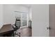 Bright home office features a desk, chair, and window blinds at 201 N Harbor Dr, Holmes Beach, FL 34217
