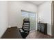 Bright home office features a desk, chair, and window blinds at 201 N Harbor Dr, Holmes Beach, FL 34217
