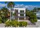 Modern two-story home with a garage and landscaping at 201 N Harbor Dr, Holmes Beach, FL 34217