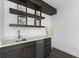 Modern kitchen with white cabinets, stainless steel appliances, and a large island at 201 N Harbor Dr, Holmes Beach, FL 34217