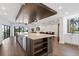 Open concept kitchen with large island and hardwood floors at 201 N Harbor Dr, Holmes Beach, FL 34217