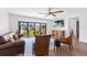Bright living room with hardwood floors, leather furniture, and large windows at 201 N Harbor Dr, Holmes Beach, FL 34217