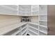 Walk-in pantry with ample shelving and microwave at 201 N Harbor Dr, Holmes Beach, FL 34217