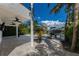 Outdoor patio with pavers, ceiling fans, and canal views at 201 N Harbor Dr, Holmes Beach, FL 34217